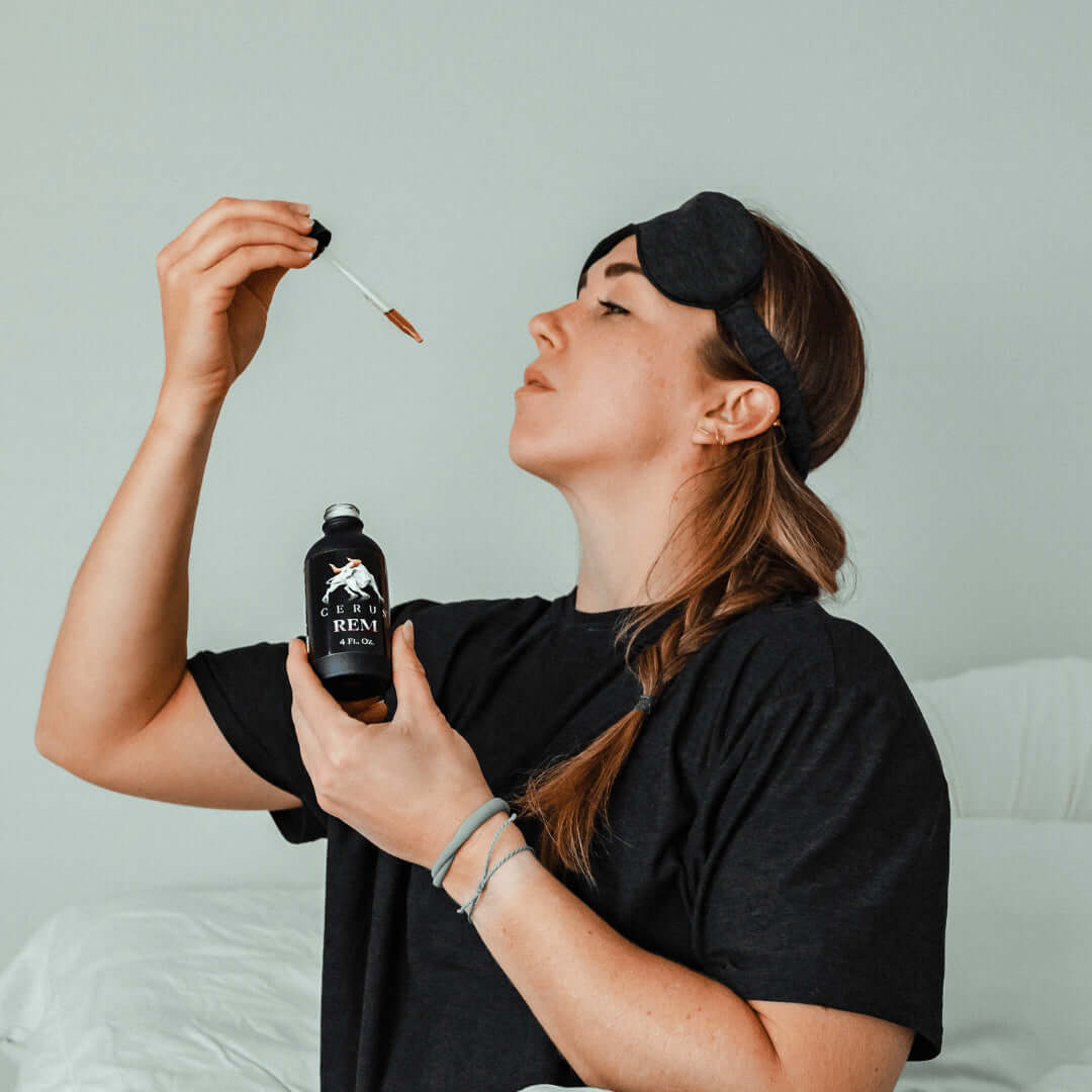 woman taking a dose out of a REM sleep supplement bottle
